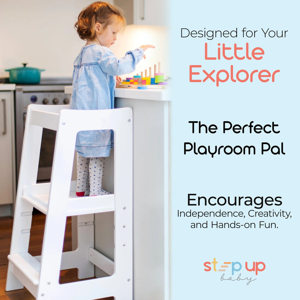 image showing a child in white toddler tower playing with wooden toy